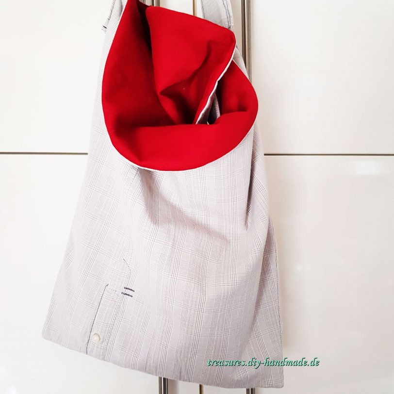 extravagante graukarierte Tasche